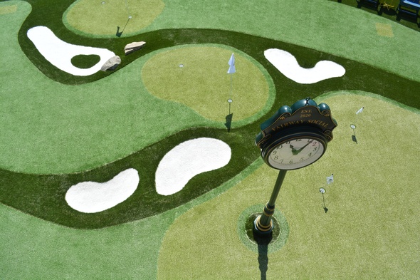 Metro New York Synthetic grass golf course with sand traps and golfers